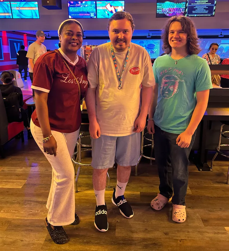 Empowered Living SLS community members enjoying a bowling outing together